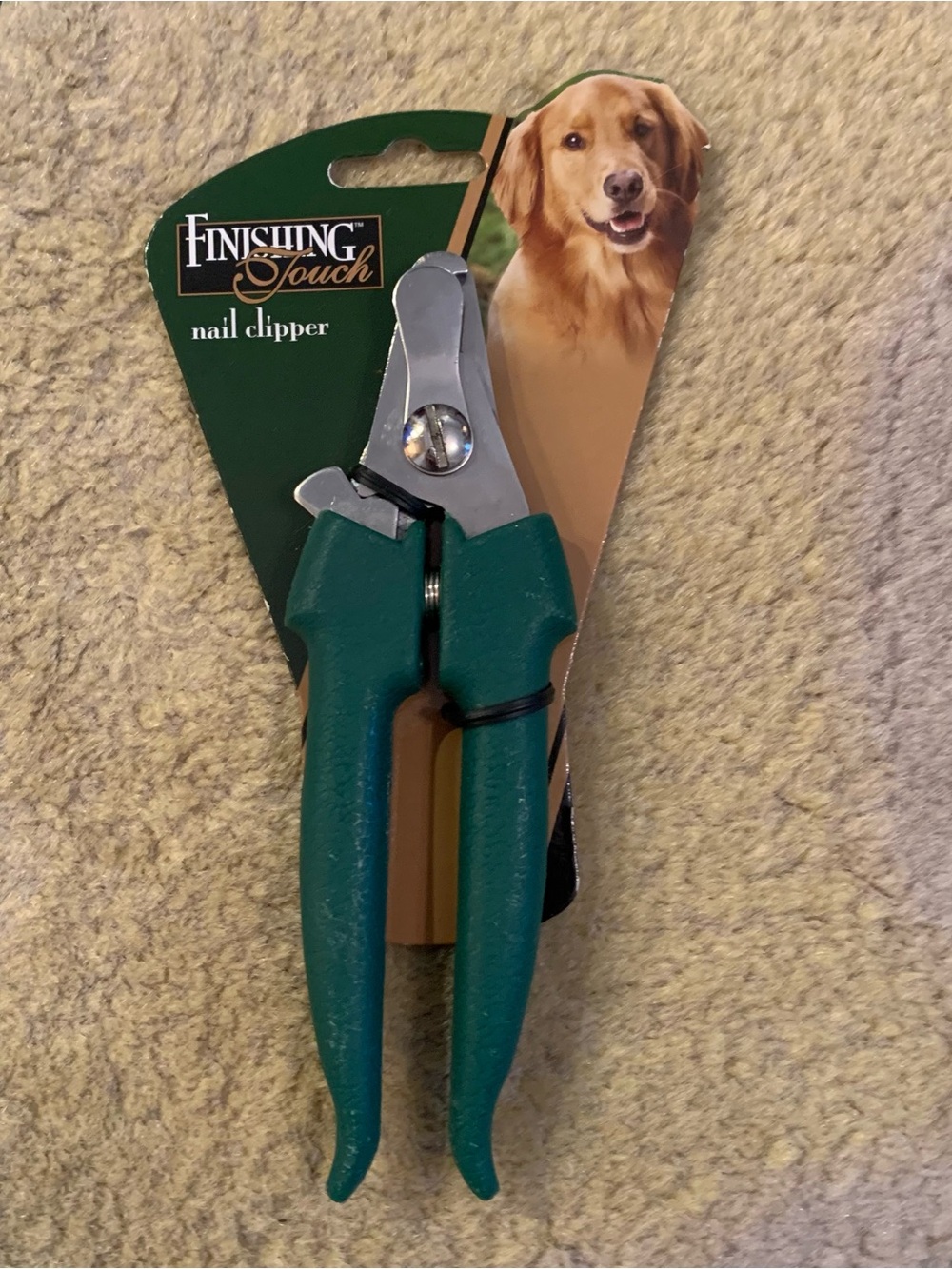 Finishing Touch green-handled scissor-style dog nail clippers